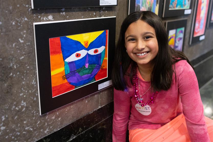 Students and their family at an art show